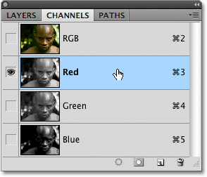 Selecting the Red color channel in the Channels panel in Photoshop.